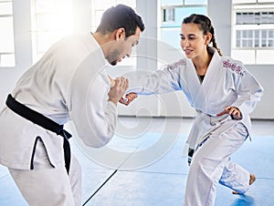 Man, karate and coach training woman in fitness, workout and exercise class for competition, black belt fight or self