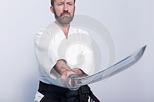 A man with katana on Iaido practice