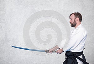 A man with katana on Iaido practice