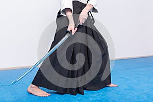 A man with katana on Iaido practice