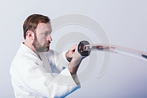 A man with katana on Iaido practice