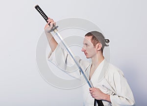 A man with katana on Iaido practice