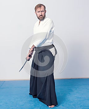 A man with katana is ready to attack