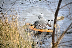 Man Kayaking on Comus Lake, Delavan, Wisconsin