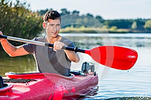 Man kayaking on lake