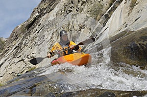 Man Kayaking In Mountain River