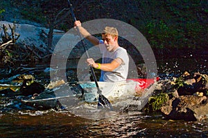 Man kayaking on river
