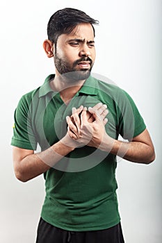 Man keep hands on chest pain zone in white background