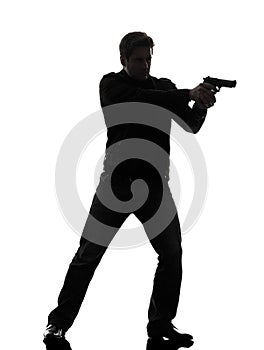 Man killer policeman aiming gun standing silhouette