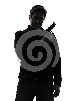 Man killer policeman holding gun portrait silhouette