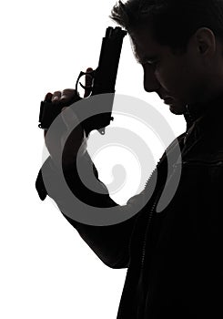 Man killer policeman holding gun portrait silhouette