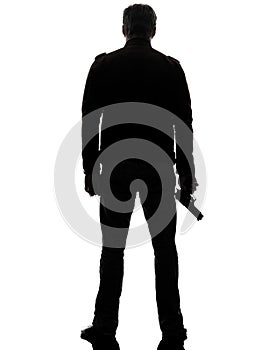 Man killer policeman holding gun walking silhouette