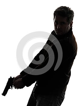 Man killer policeman holding gun walking silhouette