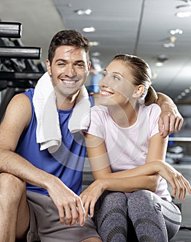 Man kissing girlfriend at the gym