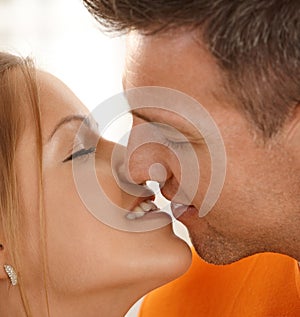 Man kissing woman