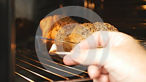 Man in the Kitchen Firing Oven with Matches