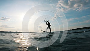 A man kite surfing on river. Kite surfer kiteboarding.