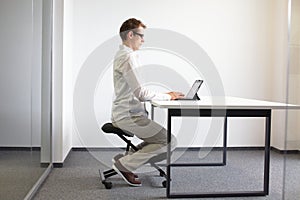 Man on kneeling stool - correct sitting position