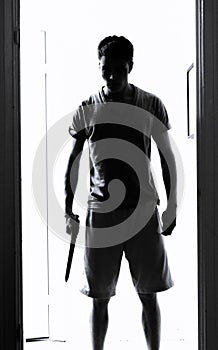 Man with knife silhouette photo