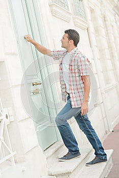 Man knocking at door arrive photo