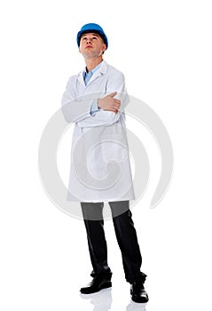 Man in a lab coat and helmet