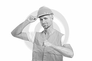 man laborer isolated on white, pointing. man laborer in white studio. man laborer on background.