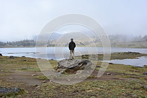 Man at the Laguna de Mucubaji lake in Merida, Venezuela