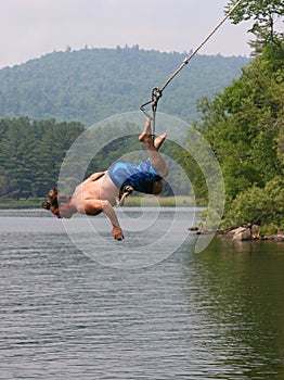 Man on a lake swing