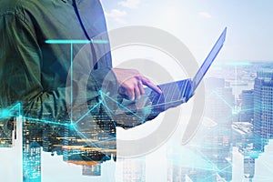 Man with laptop in city, network interface