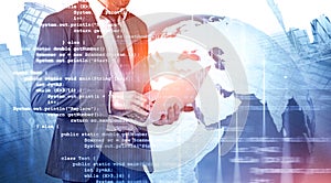 Man with laptop coding in city