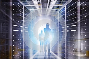 Man with laptop in server room interior