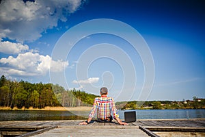 Man with laptop working outdoor