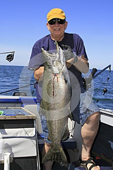 Man with Large Fish - Lake Ontario King Salmon