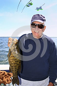 Man with Large Fish - Lake Ontario Smallmouth Bass photo