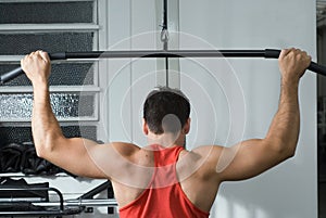 Man on the Lat Pull-Down Machine