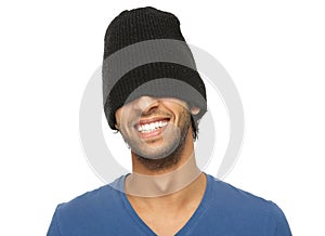 Man laughing with black hat covering eyes