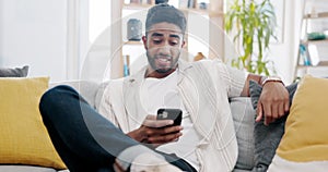 Man laughing at meme on smartphone, relax at home and social media scroll with technology and communication. Comedy