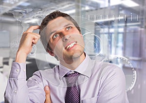 Man in lavendar shirt scratching head against white interface and blurry room