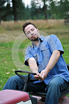 Man on lawn mower