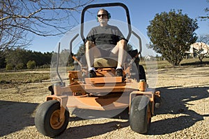 Man on lawnmower