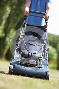 Man with lawnmower