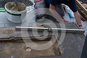 Man laying floor tiles