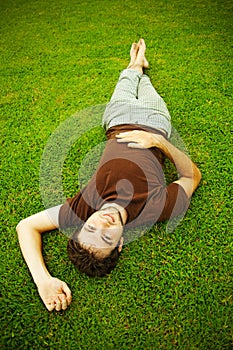 Man laying on a grass