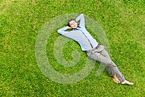 Man laying on a grass