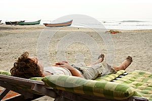 Man laying on sunbed