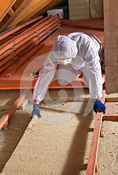 Man laying thermal insulation layer - wearing protective clothing