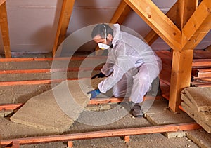 Man laying thermal insulation
