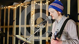 Man lead guitarist playing guitar and sing song