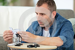 Man learning how to use camera