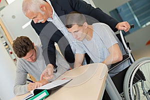 Man lecturing students in university lecture theatre